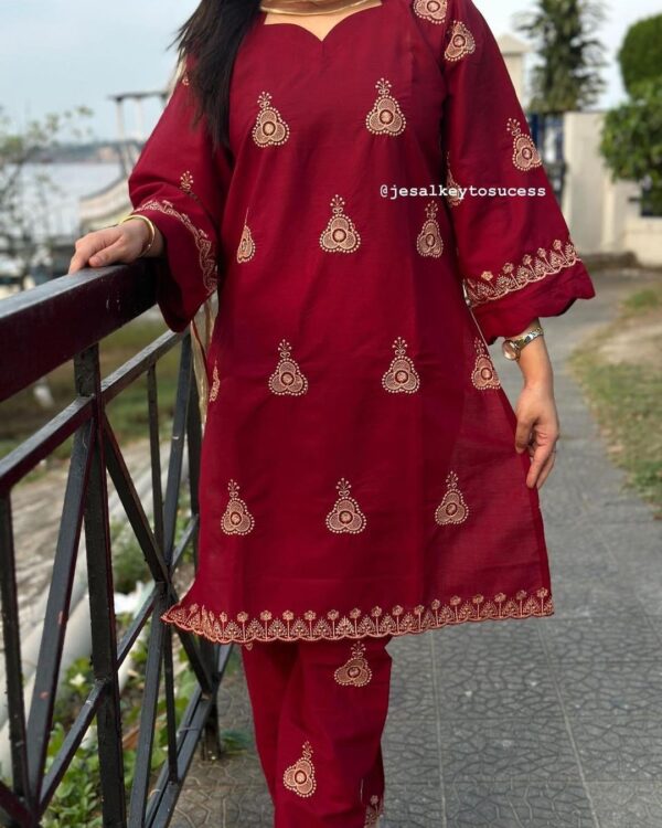 Pakistani three-piece suit with AC cotton kameez featuring jumka embroidery, a pure cotton printed dupatta, and matching embroidered pants. Available in sizes 38, 40, 42, and 44.